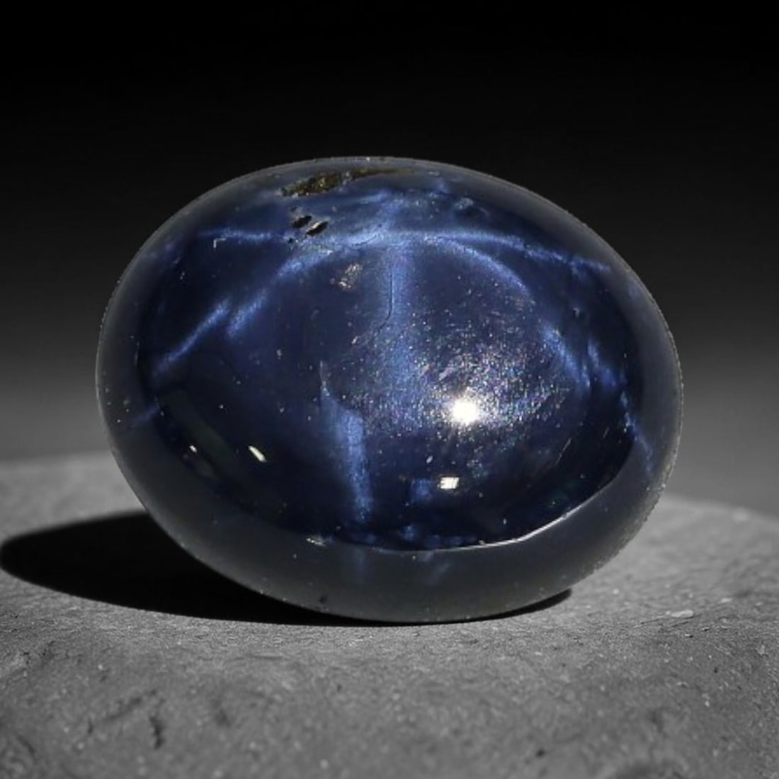 3.22 Carats Natural 6 Ray Blue Star Sapphire Loose Gemstone, 42XX: This star sapphire is crafted from natural corundum deposits and refined into a sleek polished cabochon form through professional lapidary finishing procedures. The distinct six-ray star asterism disp