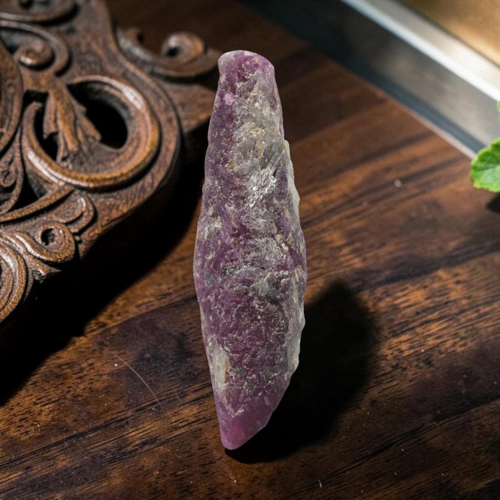 17.34ct Natural Mauritania Ruby Rough (Unheated), 59XE: This unheated Mauritania ruby rough is a captivating natural crystal specimen, featuring vivid magenta-purple ruby formations embedded in a contrasting greyish matrix. The stone's rugged, unpolished s