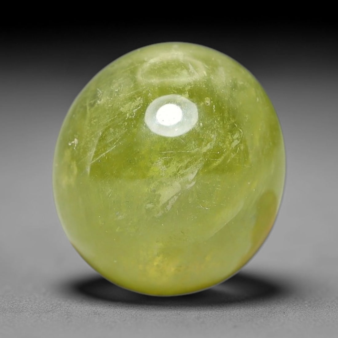 5.90 Carats Natural Madagascar Greenish Yellow Sapphire Cabochon Loose Gemstone, 37XX: Formed from natural corundum sourced from Madagascar geological deposits, this raw mineral material is processed into a polished cabochon form through professional stone finishing techniques with a sm