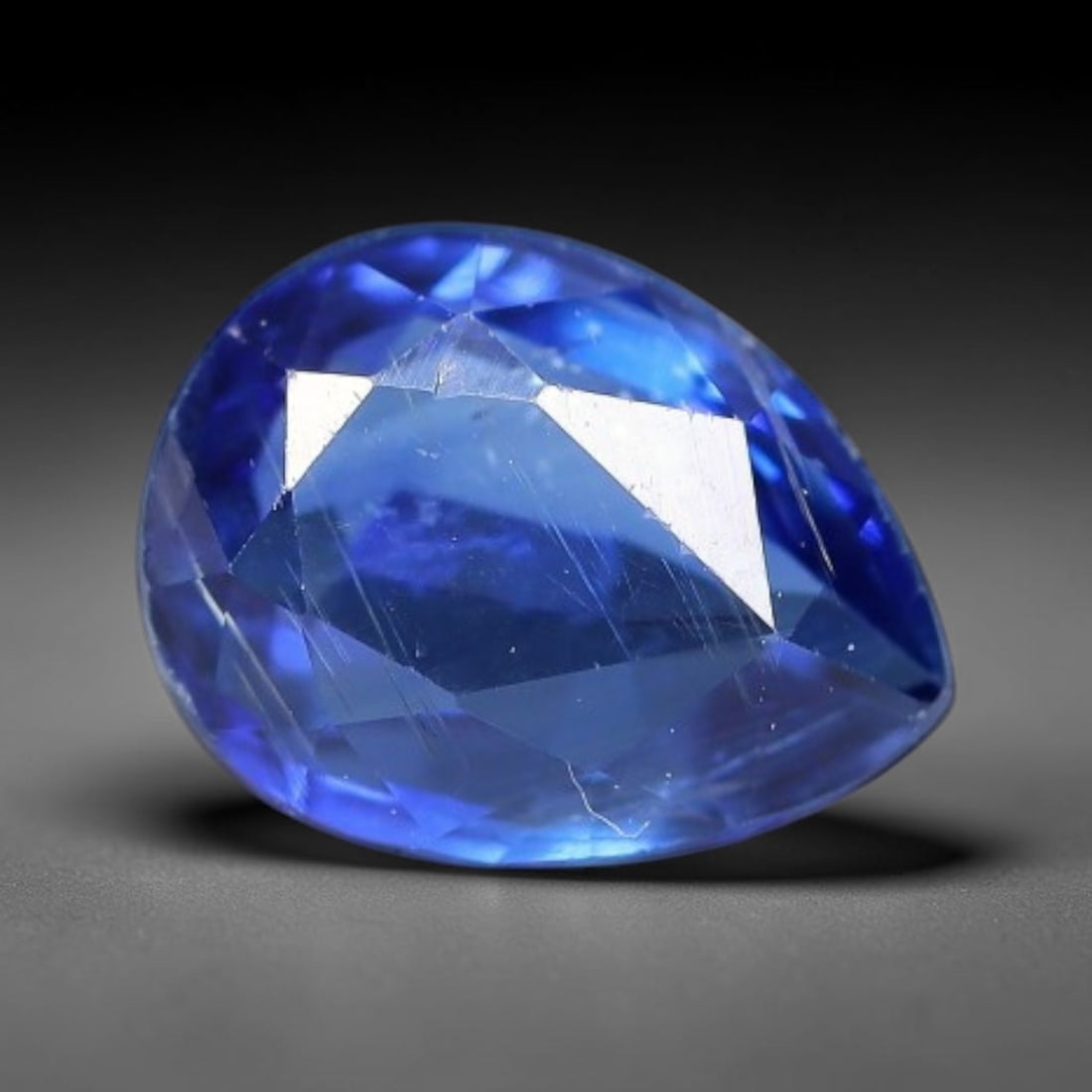 1.51 Carats Natural Brazilian Kyanite Pear Faceted Loose Gemstone, 64XY: This specimen consists of natural kyanite mineral material refined via professional faceted lapidary work, with uniform polished surfaces across the crystal exterior. Natural internal particulate mark