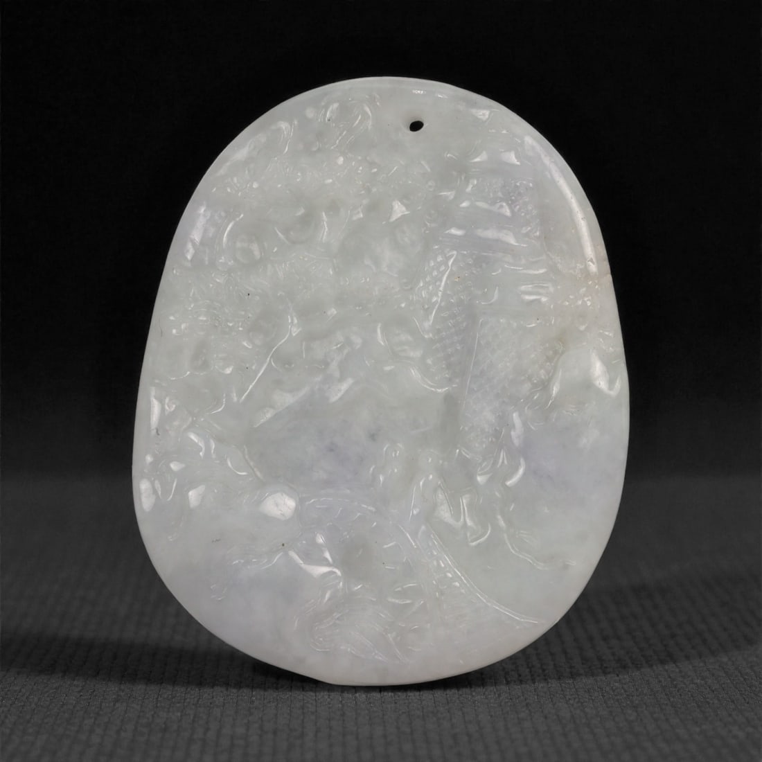 Natural Type A Burmese Jadeite Jade Pendant Plaque - Carved Stone Relief, 64ZD: Carved from pale celadon jade with soft translucency and subtle milky clouding, this oval pendant plaque is worked in shallow relief with layered decorative motifs emerging through gently raised forms