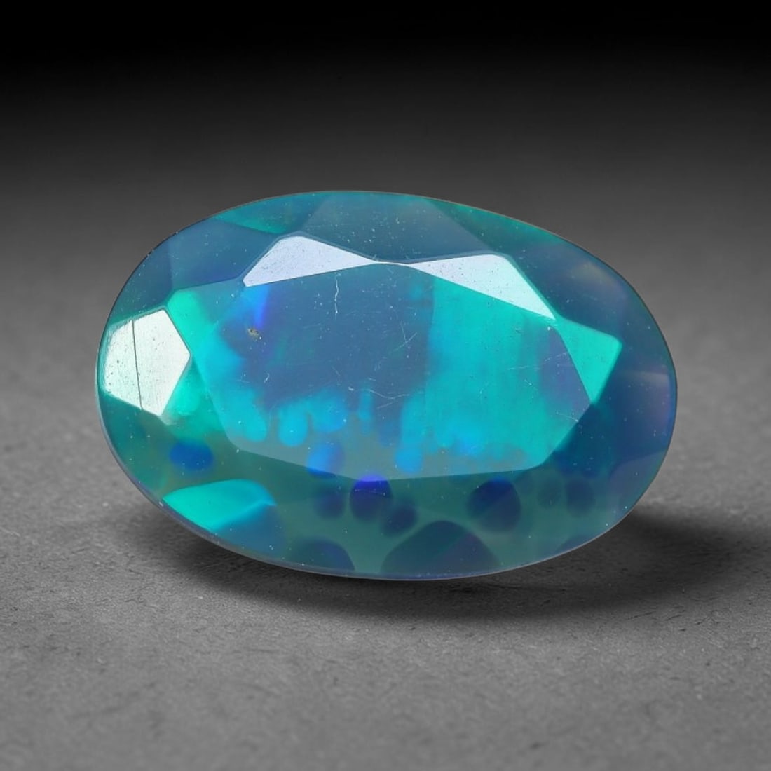 2.03 Carats Natural Ethiopian Welo Black Opal Oval Faceted Loose Gemstone, 71XX: This opal is mined from the Welo region of Ethiopia and expertly faceted and polished into an oval shape by professional lapidary techniques. Natural fine internal particles and faint natural fissures