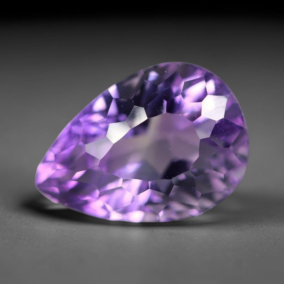 10.45 Carats Natural Brazilian Amethyst Loose Gemstone, 18WP: This natural Brazilian amethyst holds dimension readings of 20x16.7x9.7mm, a transparent crystalline quartz specimen sourced from Brazil's well-documented amethyst mineral formations that consistently
