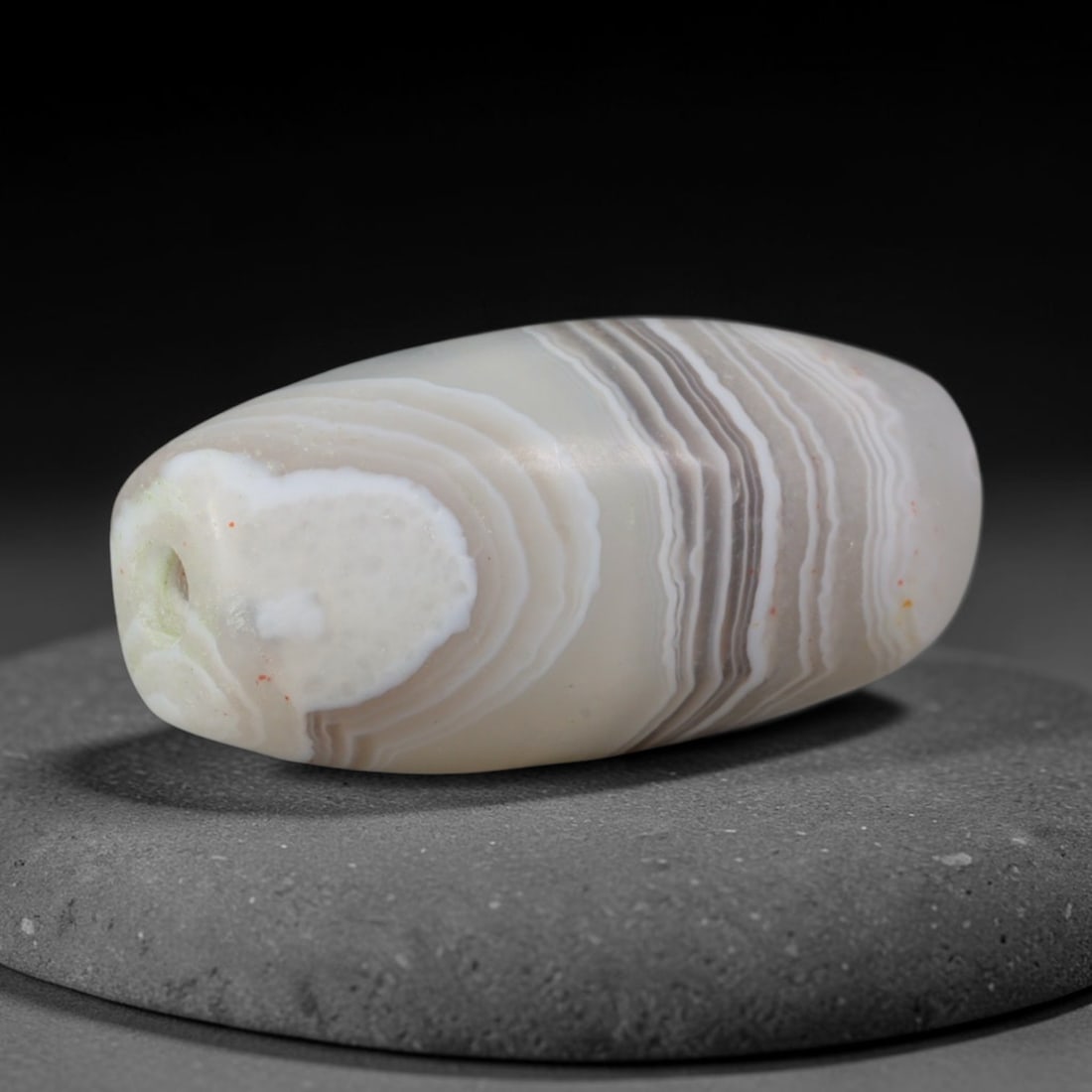 Ancient Achaemenid Persian Empire Banded Agate Barrel Bead (550-330 BCE), 92XD: This antique banded agate barrel bead originates from the Achaemenid Persian Empire, the great ancient Iranian imperial culture famed for crafting fine layered agate talismans and court trade gifts fo