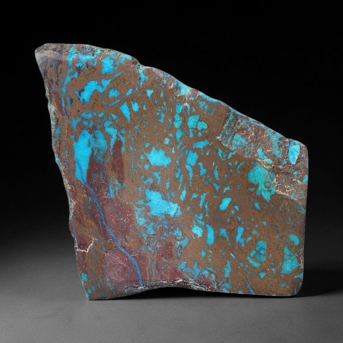 94ct Natural Peruvian Chrysocolla Polished Slab Rough, 65WV: This partial-polished chrysocolla slab features blended mineral matrix with smooth refined face and unaltered natural rugged edge across its 39x30x13mm elongated form, translucent mineral layers hold 