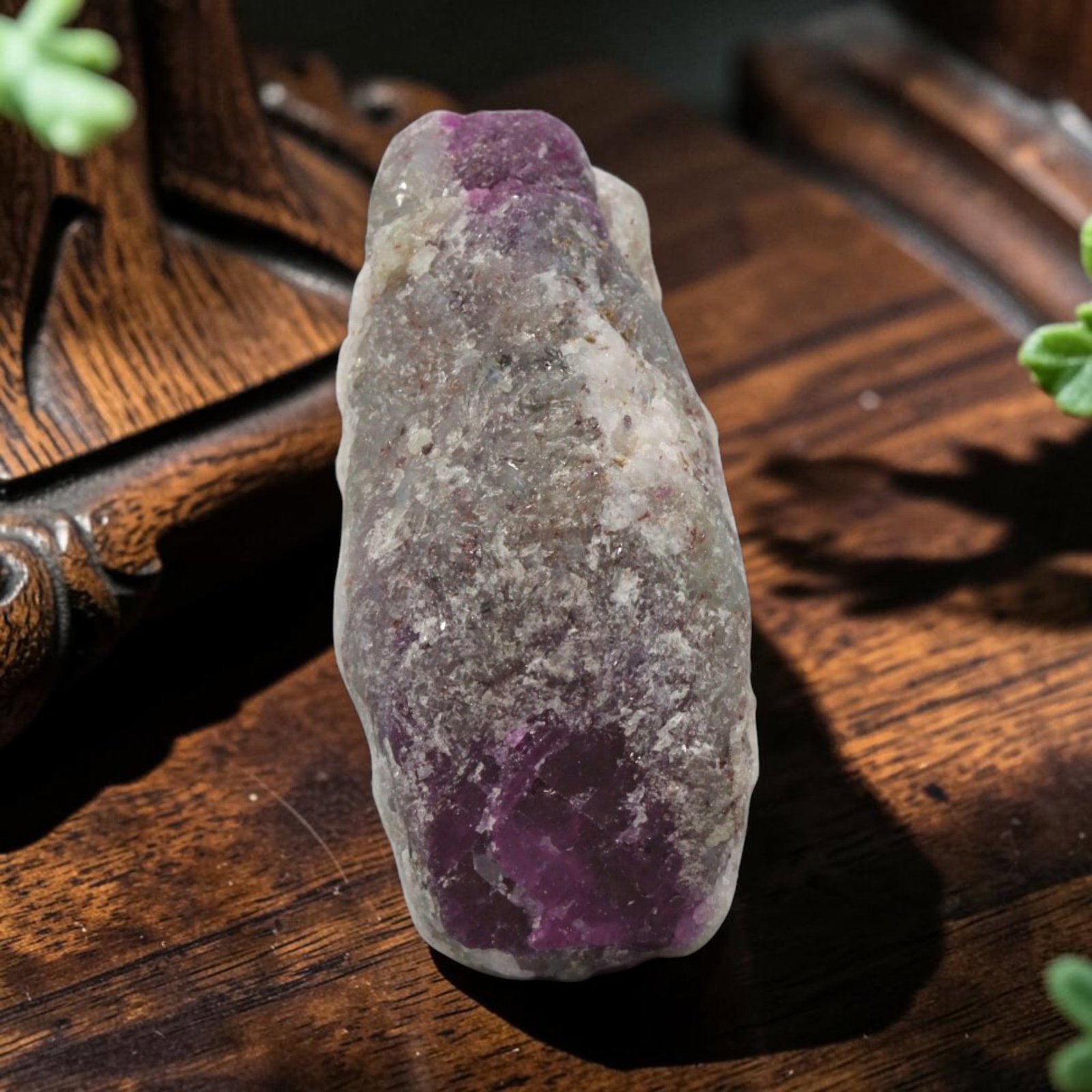 27.37ct Natural Mauritania Ruby Rough (Unheated), 68XE: This unheated Mauritania ruby rough is a captivating natural crystal specimen, featuring vivid magenta-purple ruby formations embedded in a contrasting greyish matrix. The stone's rugged, unpolished s