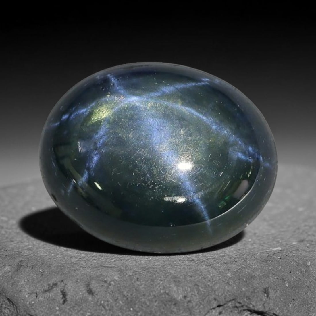 4.60 Carats Natural 6 Ray Blue Star Sapphire Loose Gemstone, 46XX: This star sapphire is crafted from natural corundum deposits and refined into a sleek polished cabochon form through professional lapidary finishing procedures. The distinct six-ray star asterism disp