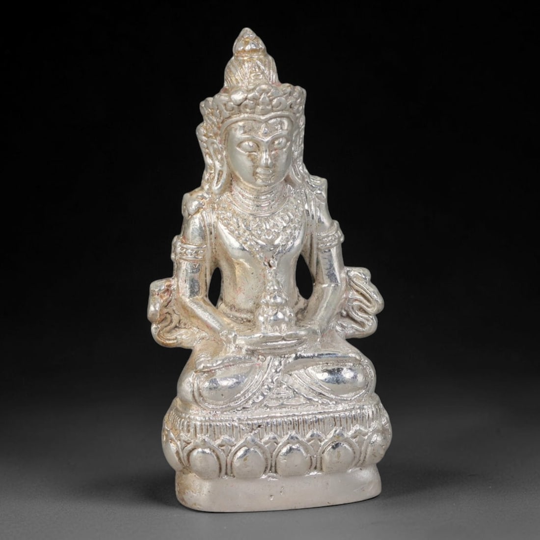Thai Silver Tone Metal Mini Sacred Statuette Amulet, 53ZB: Compact cast metal sacred figurine featuring intricate sculpted decorative elements across the elaborate head adornment, torso detailing and layered pedestal base. Minor surface wear and faint traces 