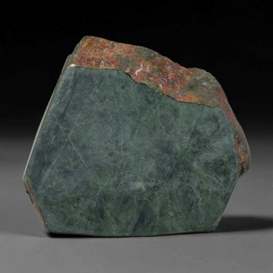 360ct Natural Type A Burmese Jadeite Jade Sliced Rough, 64YK: This specimen is a sliced rough block of natural Type A Burmese jadeite jade. The interior displays natural colour zoning with visible mineral veining and crystalline patterns typical of unprocessed j