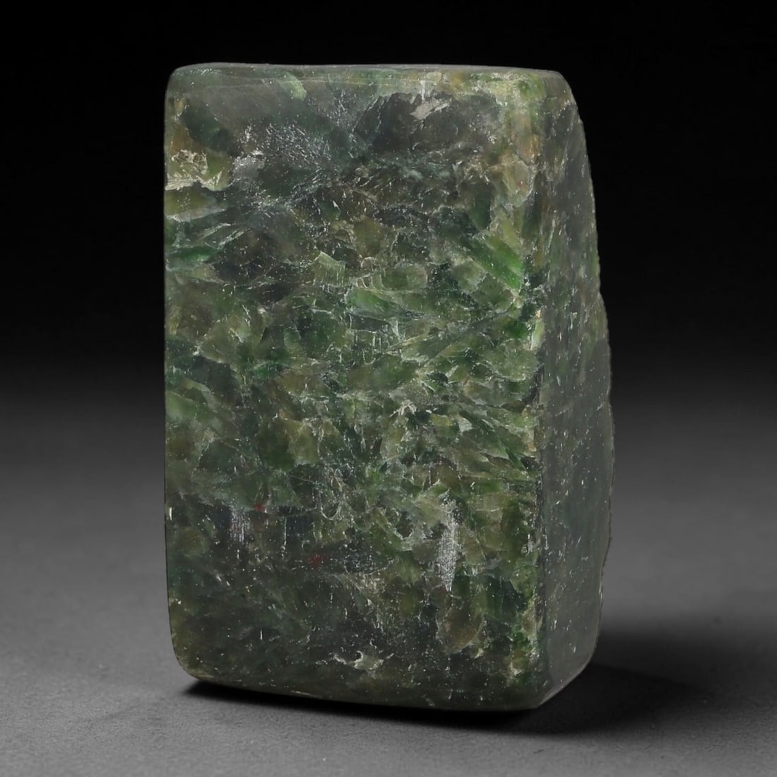 295ct Natural Type A Burmese Jadeite Jade Sliced Rough, 24YR: This specimen is a sliced rough block of natural Type A Burmese jadeite jade. The interior displays natural colour zoning with visible mineral veining and crystalline patterns typical of unprocessed j