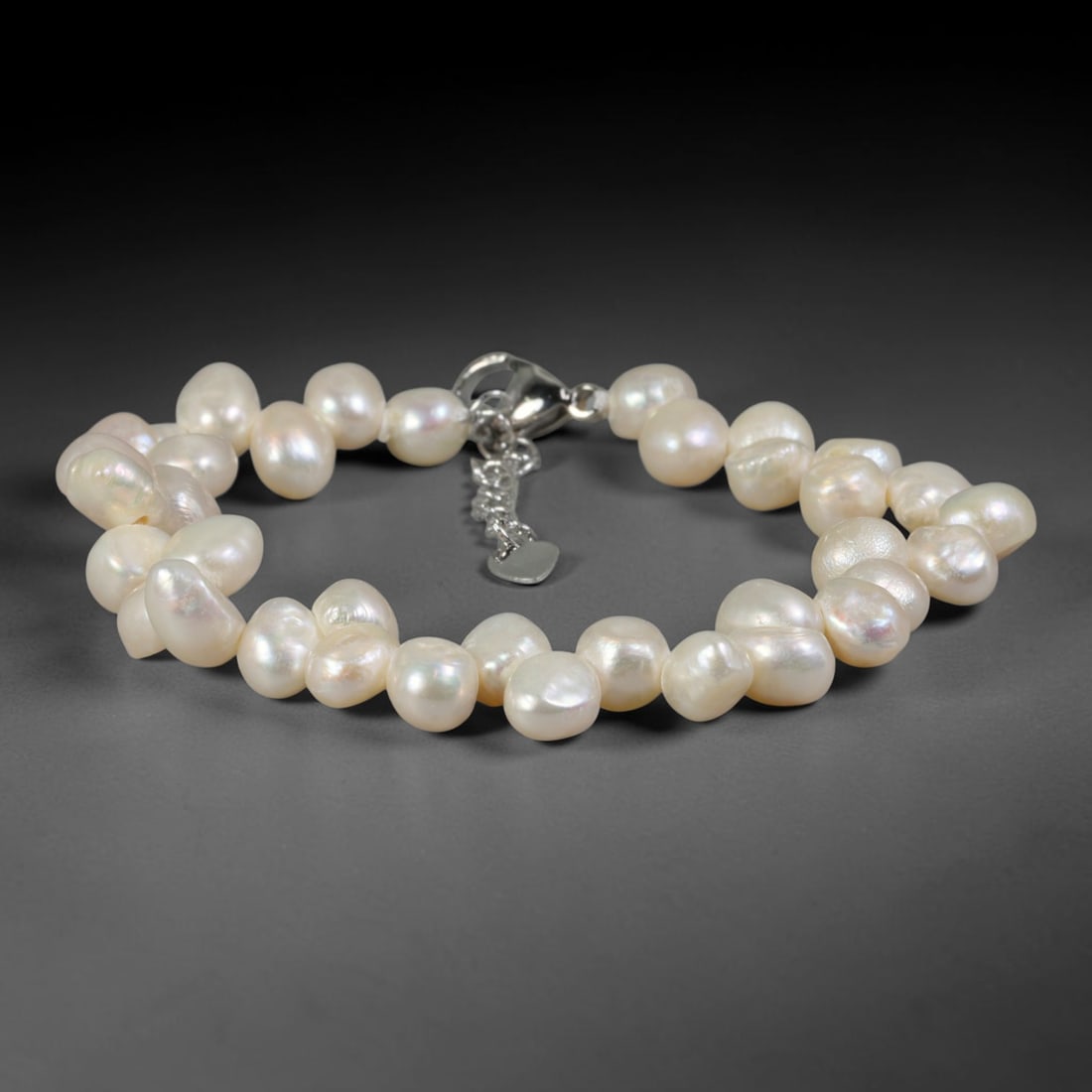 Natural Freshwater Pearl Bracelet - Tiny Baroque Milky White Pearl Strand, 95YM: Strung from petite organic baroque natural freshwater pearls with soft milky white pearlescent glow, each bead featuring uniquely miniature asymmetrical organic shapes from natural pearl cultivation. 
