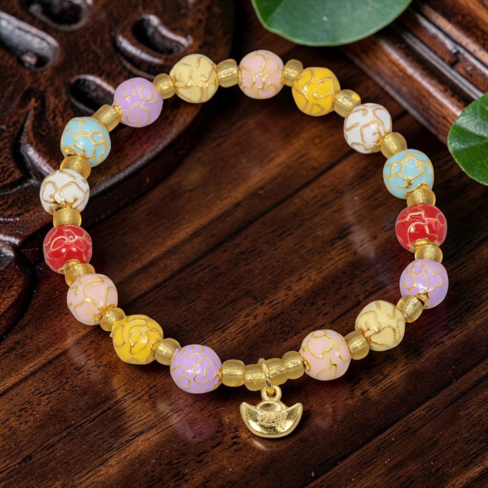 A Chinese Cloisonne Enamel Beaded Bracelet - Multicolor Gold-Tone Ingot Charm, 41YJ: This modern Chinese-style bracelet features 7.56mm round cloisonne enamel beads in a vibrant mix of pastel hues, each detailed with raised gold-tone cloud patterns. Small smooth gold-tone spacer beads