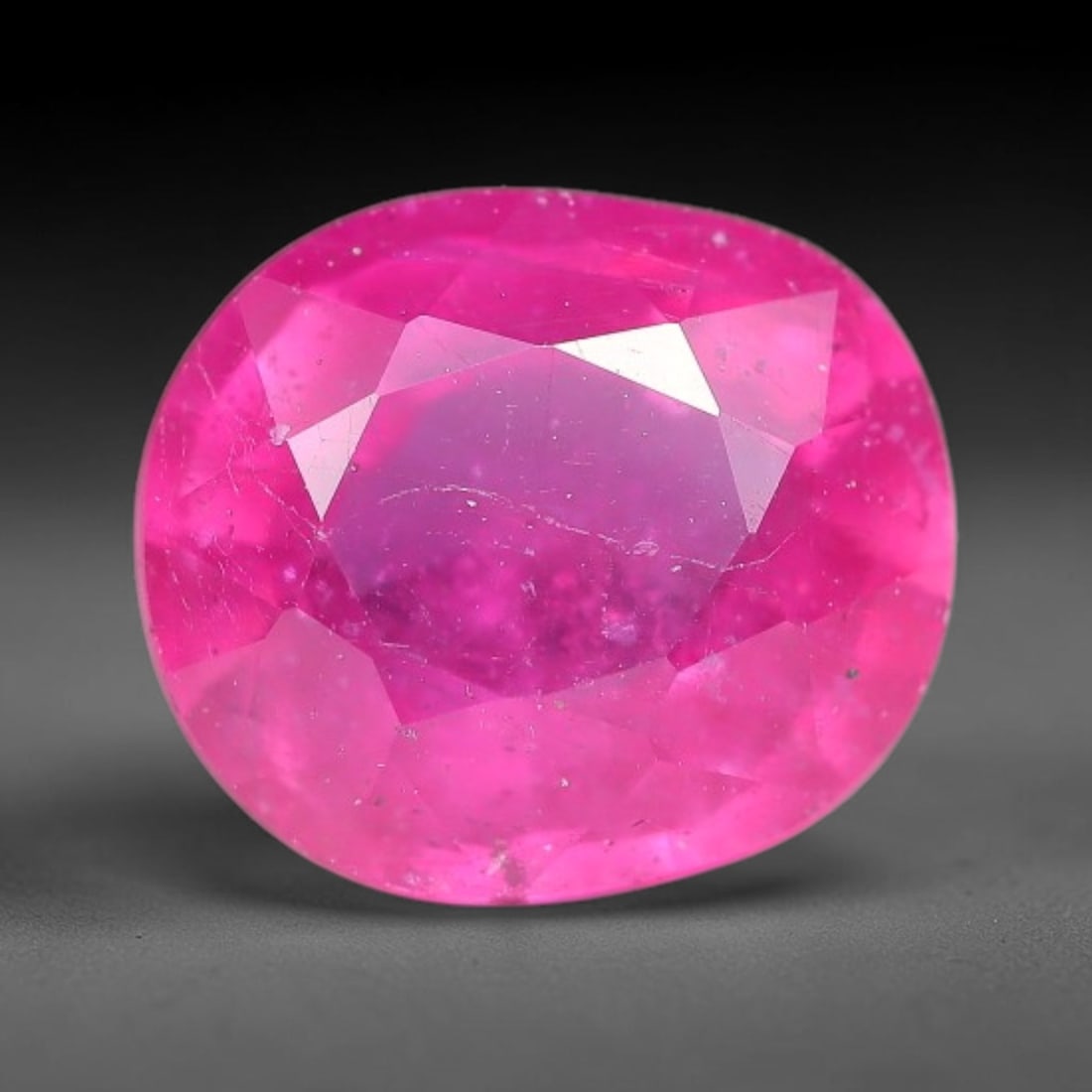 3.60 Carats Natural Mozambique Ruby Oval Faceted Loose Gemstone, 97WY: This natural Mozambique ruby is fashioned with standard oval brilliant faceting, displaying vivid saturated crimson-red hue accompanied by native fine mineral inclusions and subtle trace marks inheren