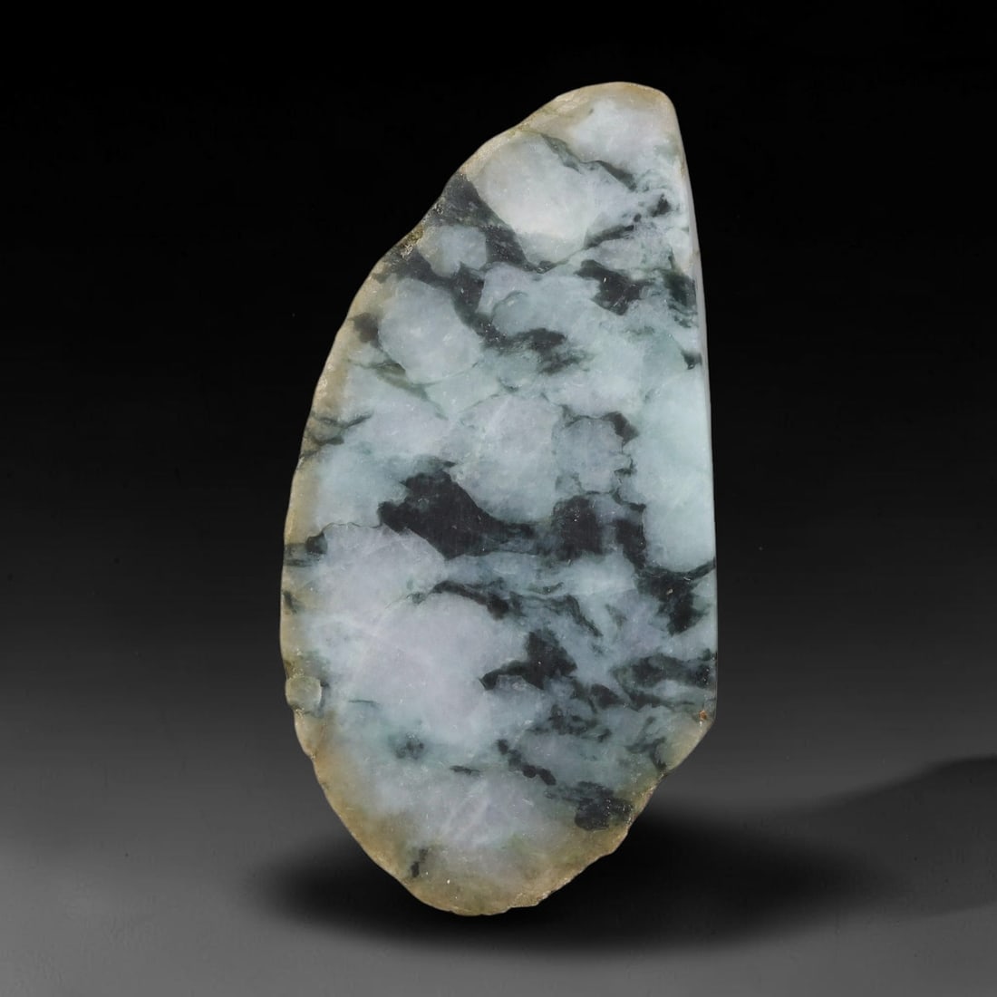 500ct Natural Type A Burmese Jadeite Jade Sliced Rough, 74YK: This specimen is a sliced rough block of natural Type A Burmese jadeite jade. The interior displays natural colour zoning with visible mineral veining and crystalline patterns typical of unprocessed j