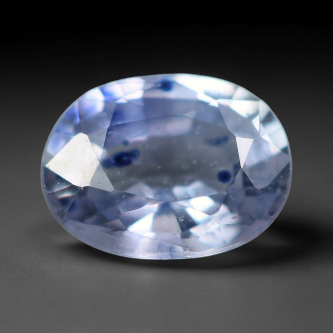 0.55 Carats Natural Light Blue Dot Inclusion Sapphire Loose Faceted Gemstone, 19XM: Natural translucent soft sky blue corundum sapphire expertly faceted loose gemstone, brilliant cut facets enhance light reflection and feature distinctive deep blue mineral dot inclusions scattered wi