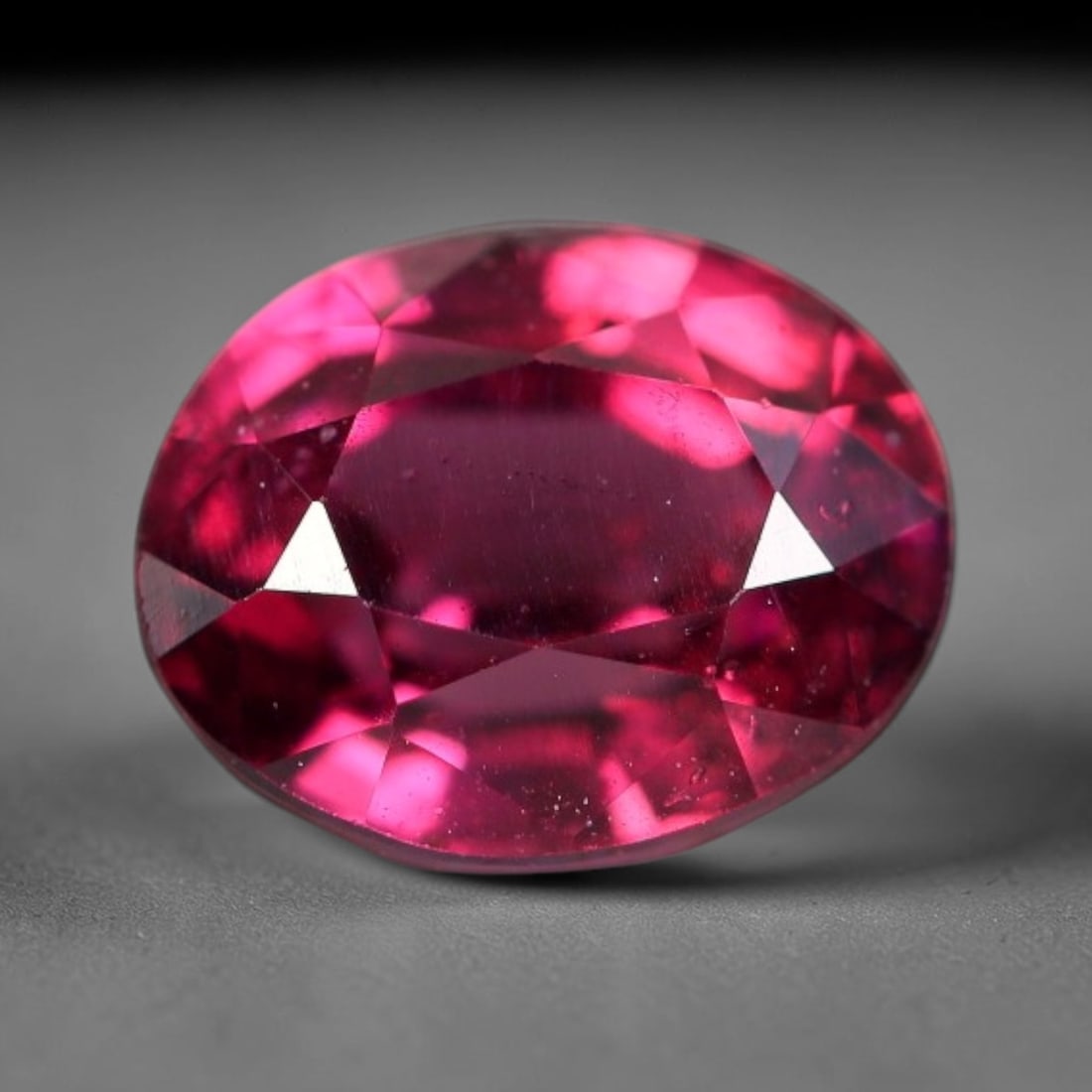 1.63 Carats Natural Deep Burgundy Red Garnet Oval Faceted Loose Gemstone, 61WS: This timeless oval faceted garnet boasts a luxuriously deep burgundy red tone that glows with vivid crimson fire across its precisely polished reflective facets. Fine natural micro mineral specks are 