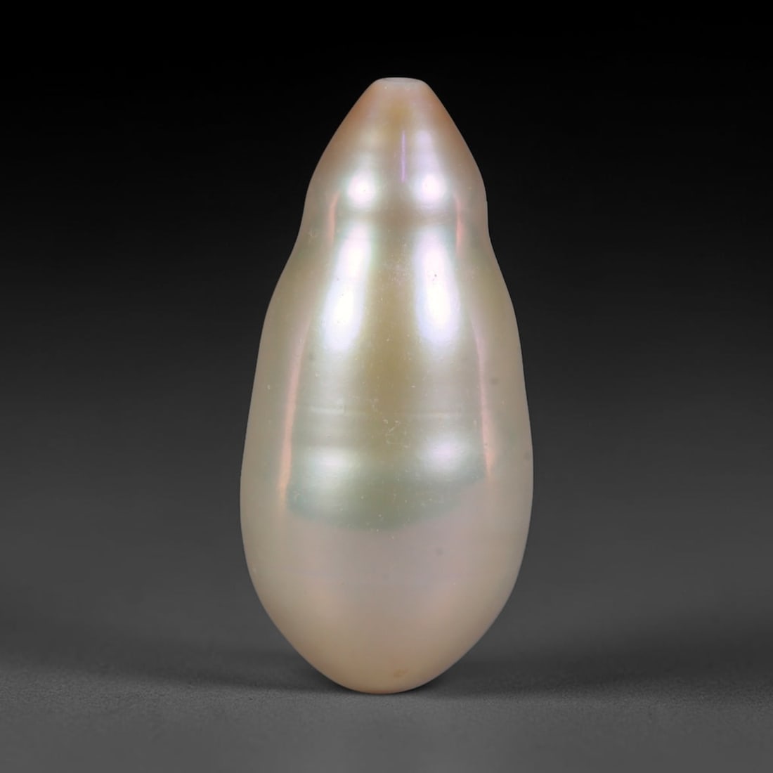 Natural Freshwater Baroque Pearl - Pale Sage Elongated Teardrop Form, 79WE: This natural freshwater baroque pearl showcases a sleek tapered teardrop silhouette wrapped in smooth luminous iridescent nacre, featuring soft ivory base tones layered with faint pale sage green and 