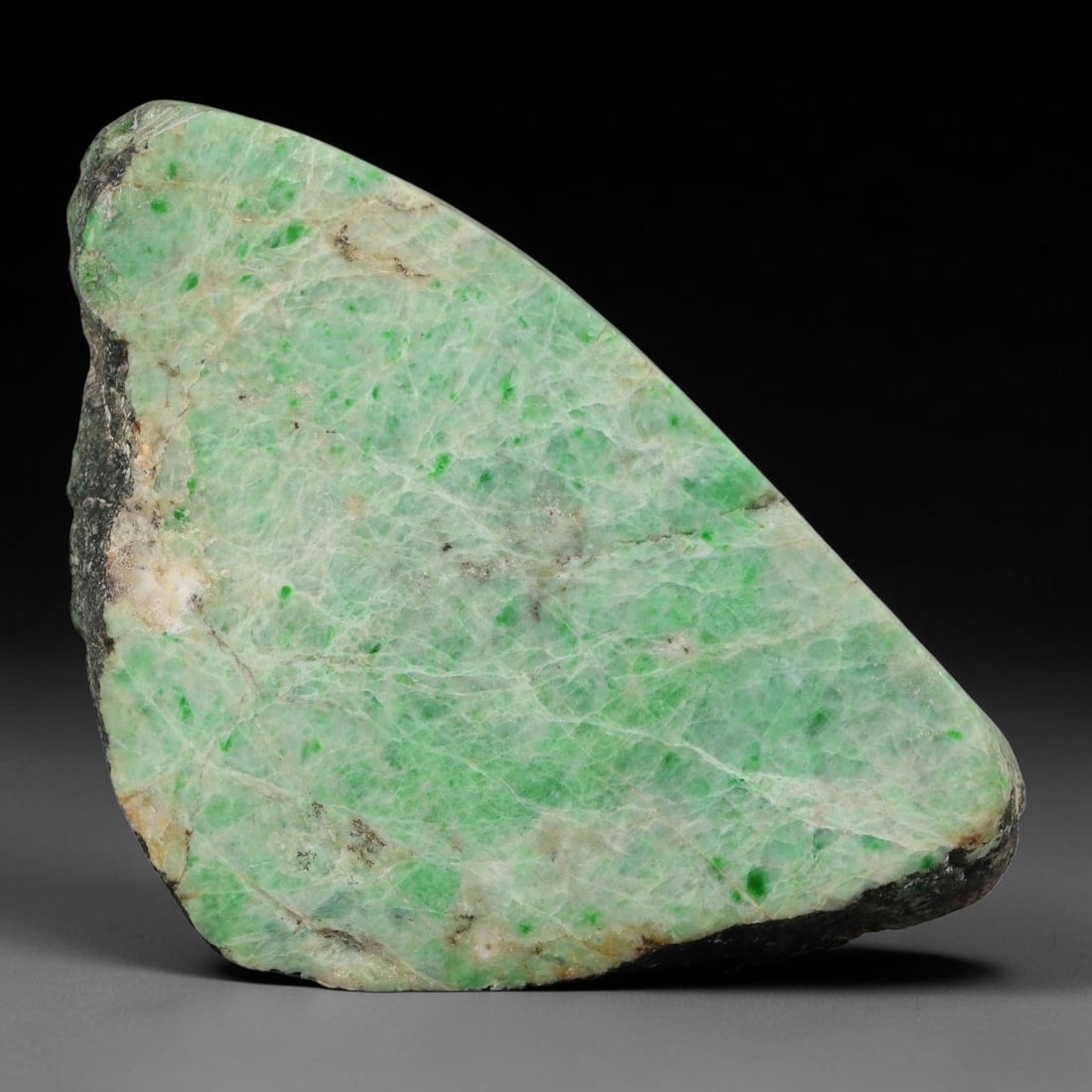 470ct Natural Type A Burmese Jadeite Jade Sliced Rough, 12YK: This specimen is a sliced rough block of natural Type A Burmese jadeite jade. The interior displays natural colour zoning with visible mineral veining and crystalline patterns typical of unprocessed j