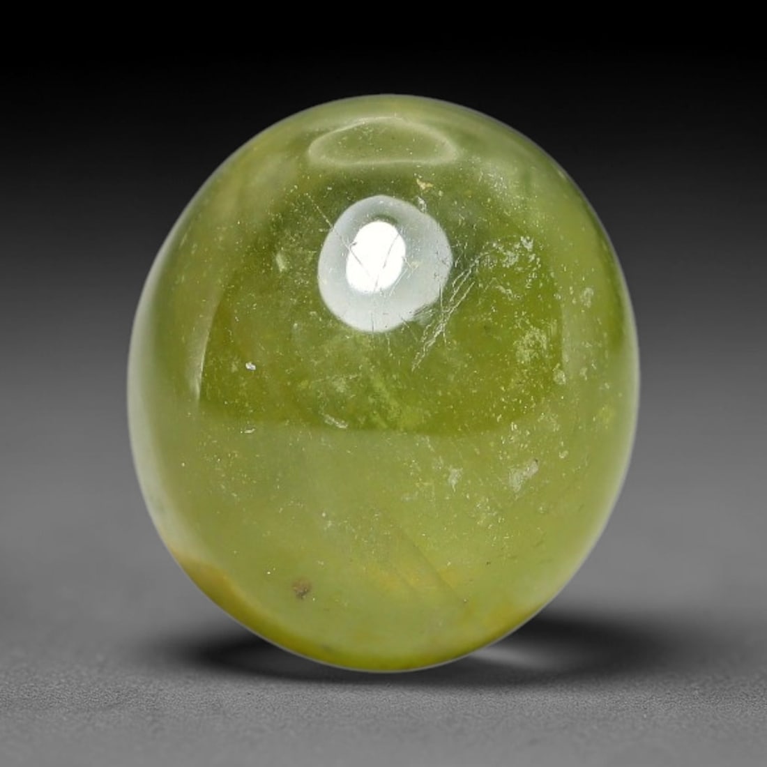 5.69 Carats Natural Madagascar Greenish Yellow Sapphire Cabochon Loose Gemstone, 31XX: Formed from natural corundum sourced from Madagascar geological deposits, this raw mineral material is processed into a polished cabochon form through professional stone finishing techniques with a sm
