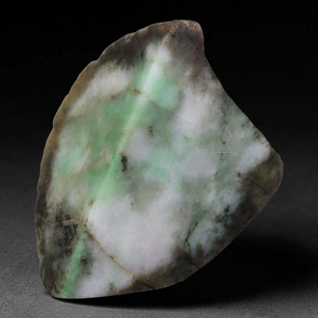 198ct Natural Type A Burmese Jadeite Jade Sliced Rough, 48YK: This specimen is a sliced rough block of natural Type A Burmese jadeite jade. The interior displays natural colour zoning with visible mineral veining and crystalline patterns typical of unprocessed j
