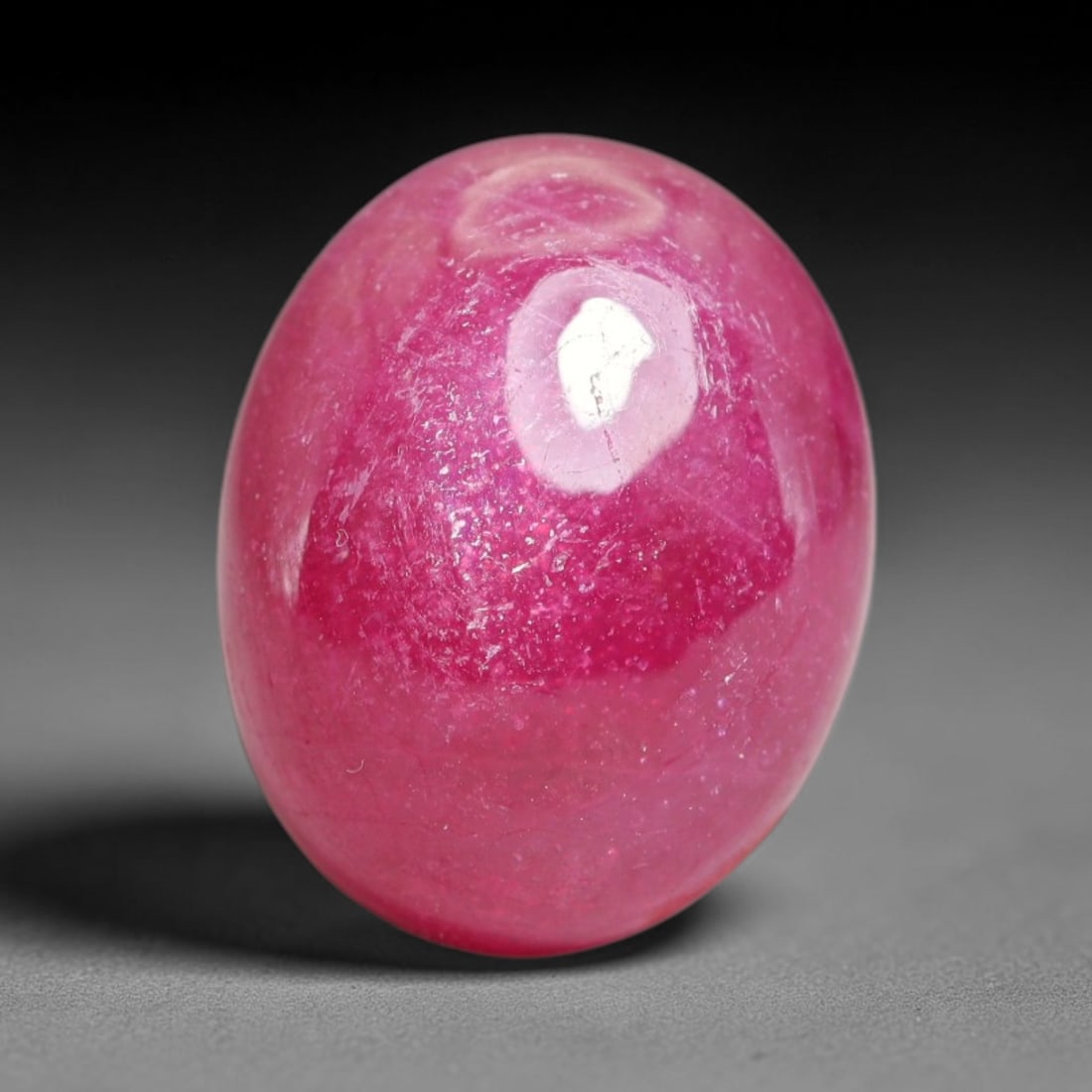 17.72 Carats Natural Mozambique Ruby Cabochon Loose Gemstone, 21XX: This ruby originates from Mozambique natural mineral deposits and receives professional cabochon grinding and polishing treatment to form a smooth glossy exterior surface. Tiny mineral particles and n