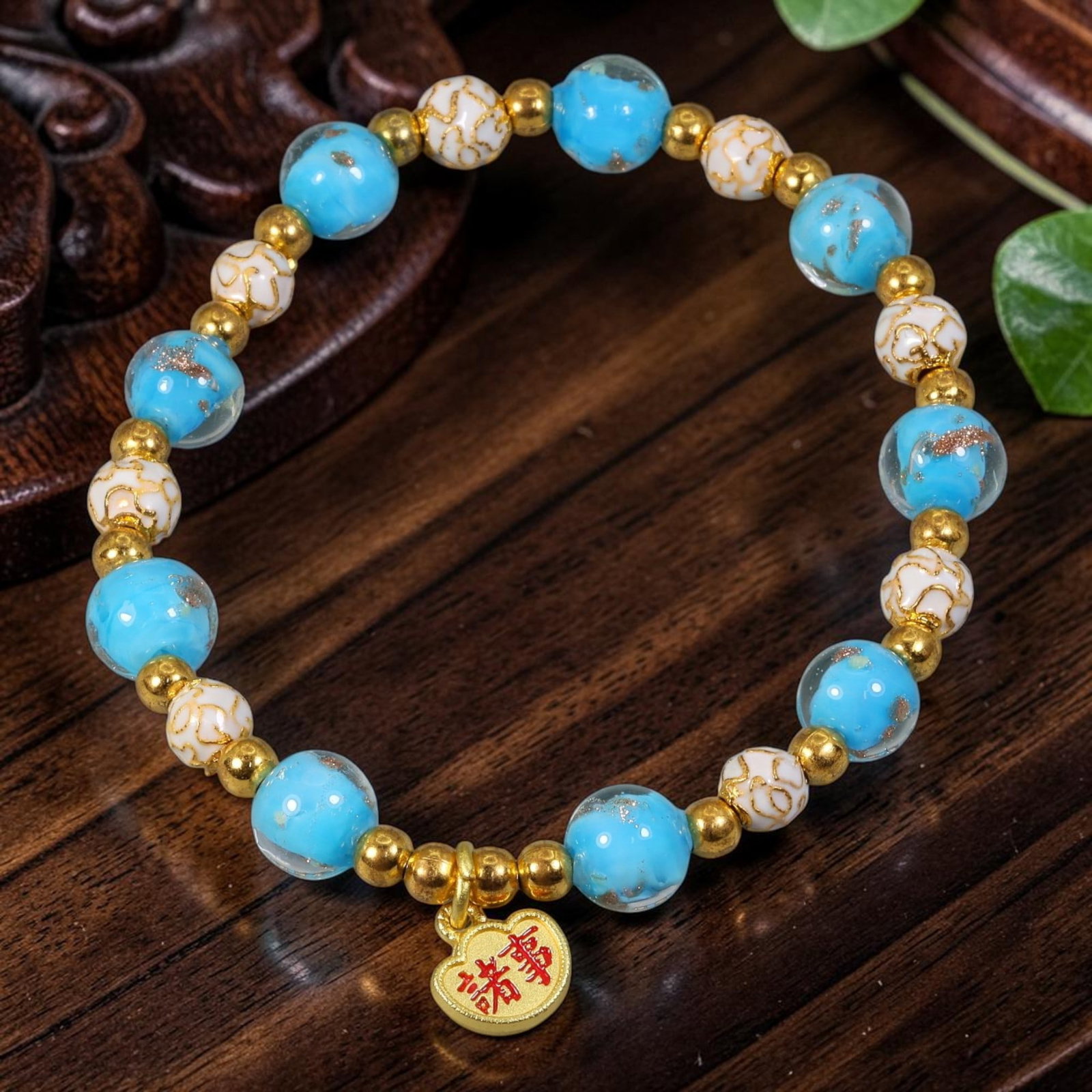 Chinese Cloisonne Enamel Beaded Bracelet - Sky Blue Gold All Wishes Charm, 84YG: This modern Chinese revival stretch bracelet combines two styles of round cloisonne enamel beads measuring 8.40 millimeters; translucent sky blue beads infused with fine gold flecks alternate with cre