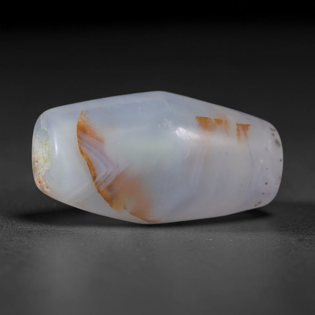 Ancient Sasanian Persian Empire Banded Agate Barrel Bead (224-651 CE), 59XD: This antique banded agate barrel bead originates from the Sasanian Persian Empire, a prominent late antique West Asian civilization celebrated for crafting layered chalcedony talismans for Zoroastrian