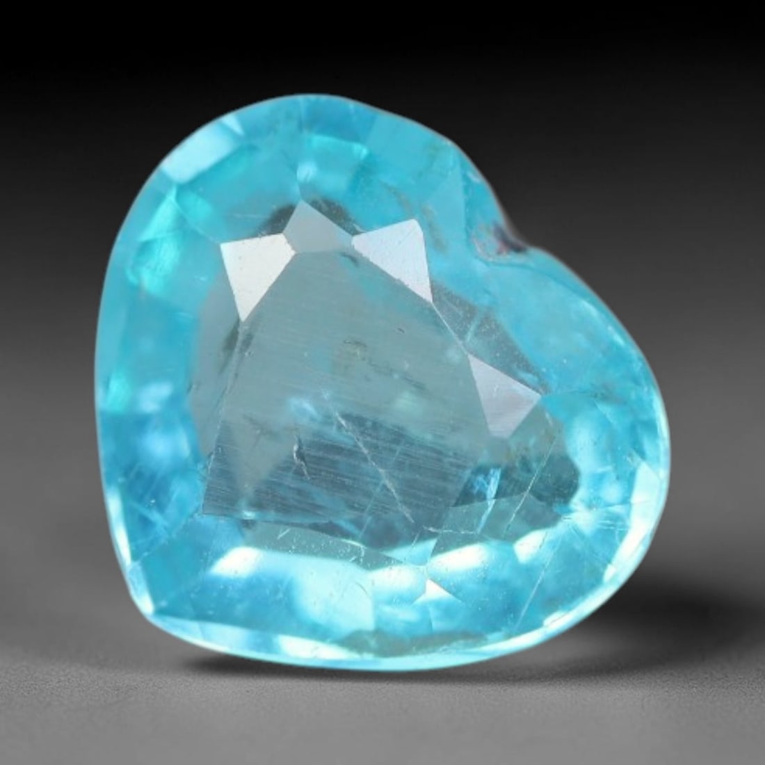 1.01 Carats Natural Bright Cyan Blue Apatite Heart Faceted Loose Gemstone, 9WW: This apatite is sourced from natural mineral deposits and processed with precise faceting and uniform high-gloss polishing by professional lapidary craftsmanship. Natural fibrous textures and tiny sca