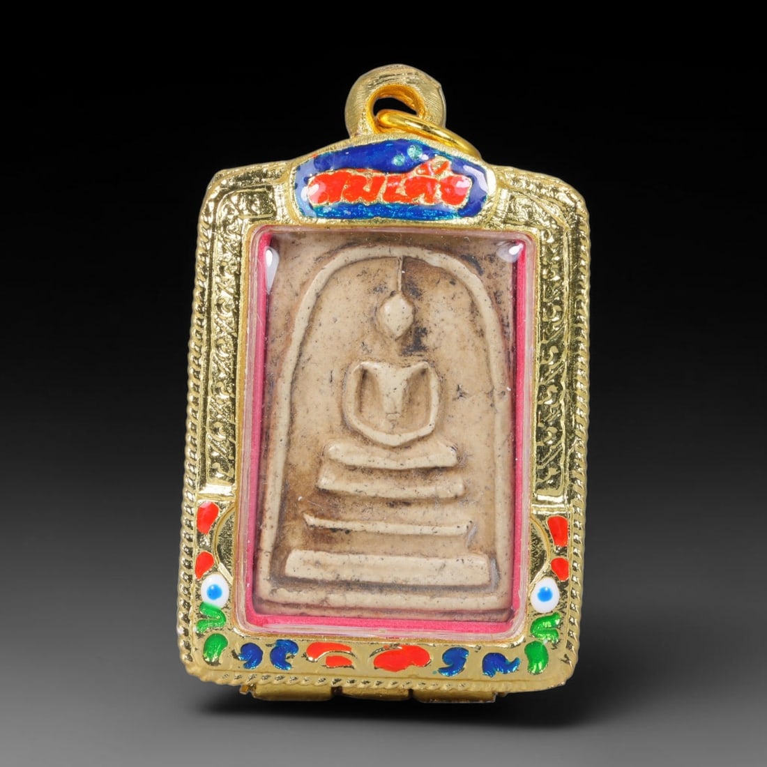 Thai Gilded Clay Metal Amulet Buddhist Votive Pendant, 55ZB: Constructed from fired clay with light gilded finishing layers, the piece uses traditional molded crafting techniques typical of Southeast Asian devotional artifacts. Its rectangular form follows stan