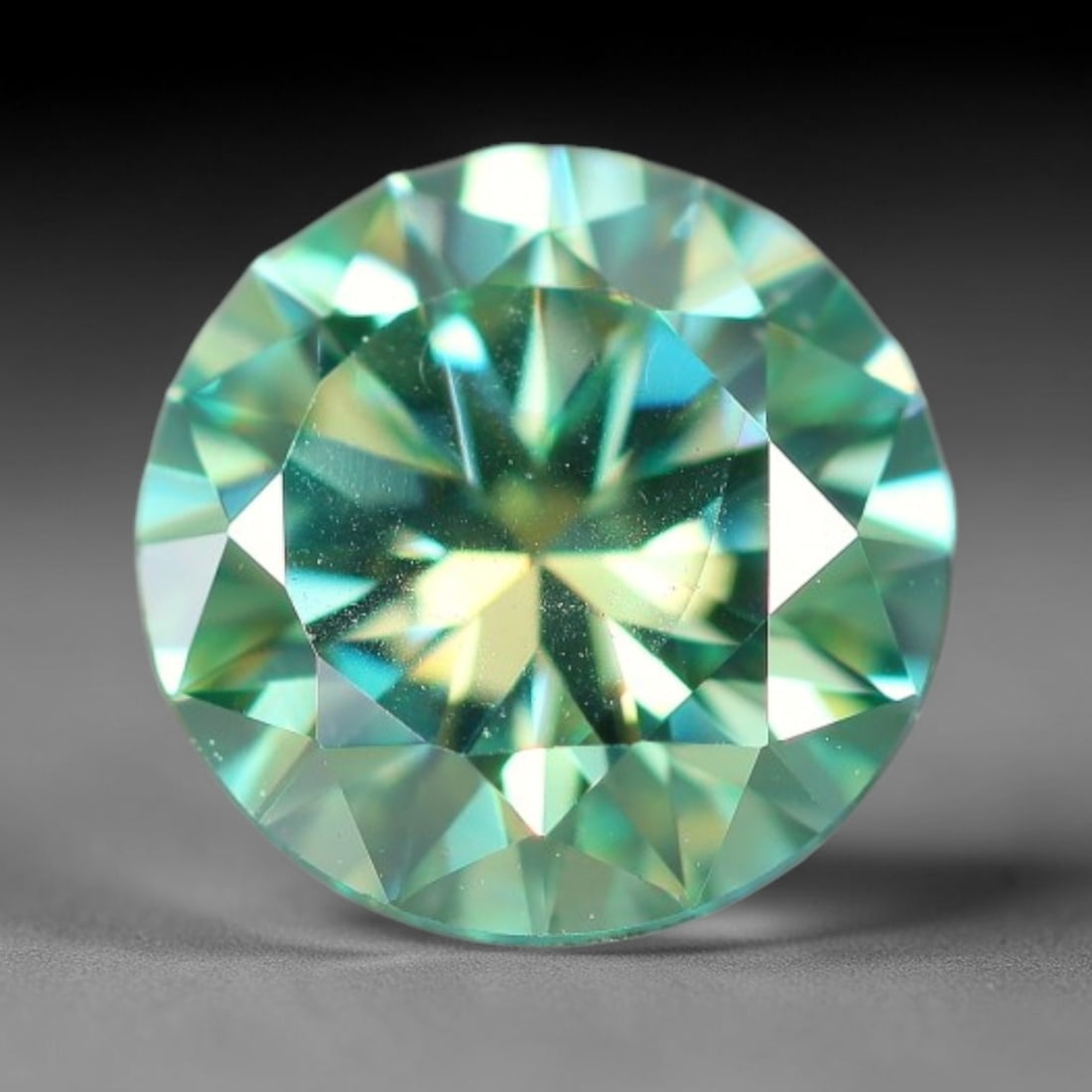 0.77 Carats Aqua Toned Moissanite Loose Gemstone, 55WP: This moissanite features dimensional measurements of 5.5x3.6mm, lab-grown silicon carbide material valued for superior light refraction that delivers vivid multi-hued sparkle across all lighting condi