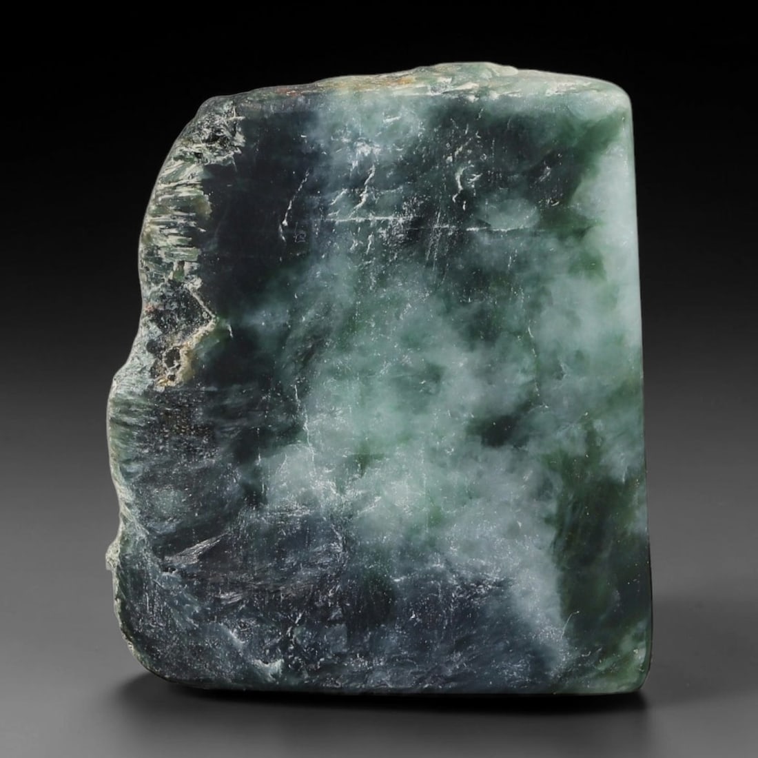 162ct Natural Type A Burmese Jadeite Jade Sliced Rough, 30YR: This specimen is a sliced rough block of natural Type A Burmese jadeite jade. The interior displays natural colour zoning with visible mineral veining and crystalline patterns typical of unprocessed j