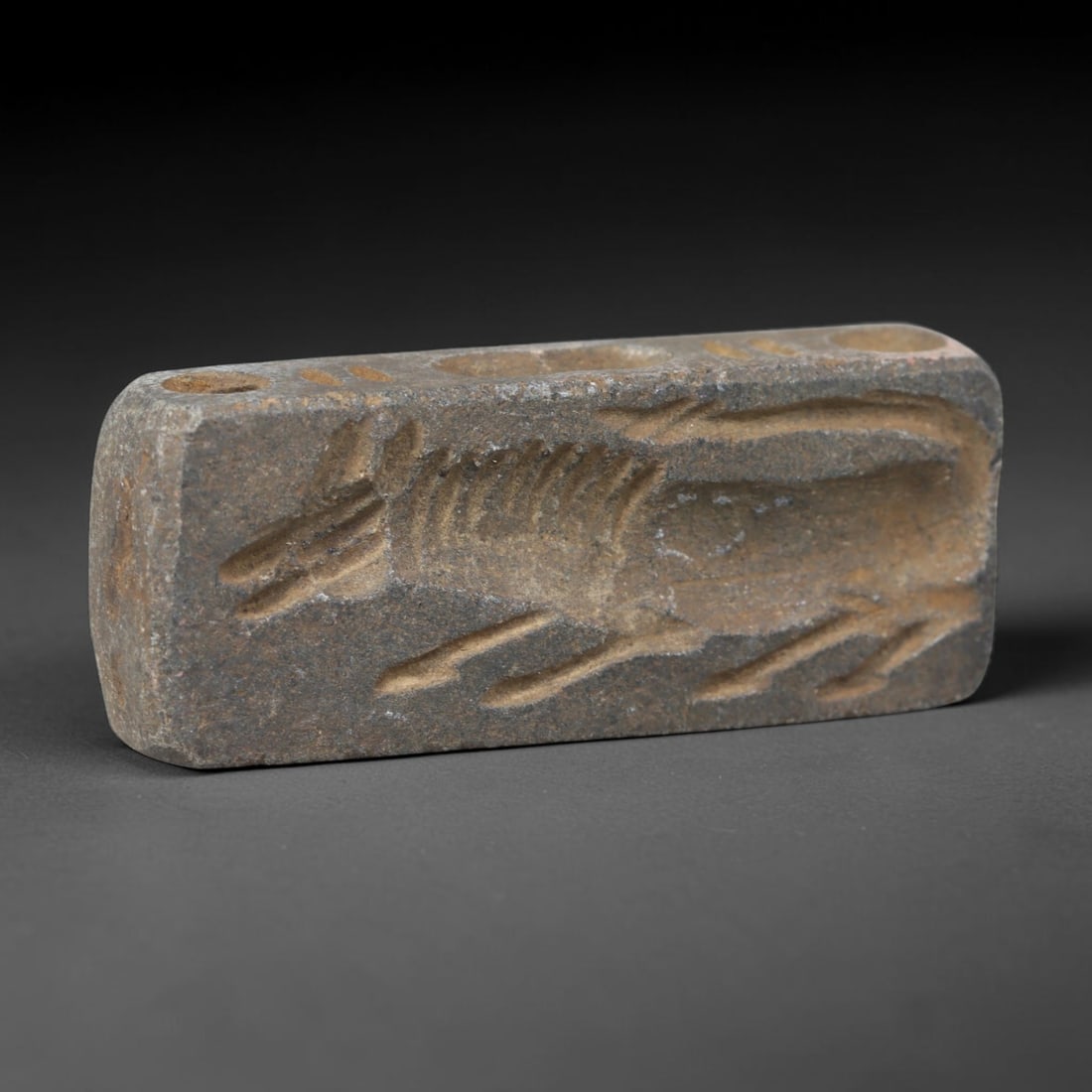 Ancient Near Eastern Hand Carved Schist Protective Amulet, 48WT: Compact antique wearable sacred talisman hand hewn from natural speckled schist metamorphic stone, originating from the broad cultural sphere of the Ancient Near East. Schist was a staple carving mine