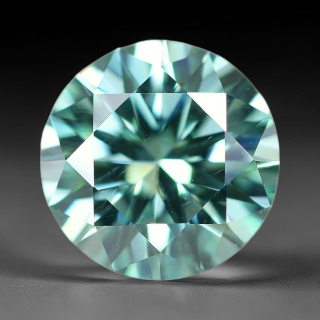 0.96 Carats Aqua Toned Moissanite Loose Gemstone, 71WP: This moissanite features dimensional measurements of 6.4x3.9mm, lab-grown silicon carbide material valued for superior light refraction that delivers vivid multi-hued sparkle across all lighting condi