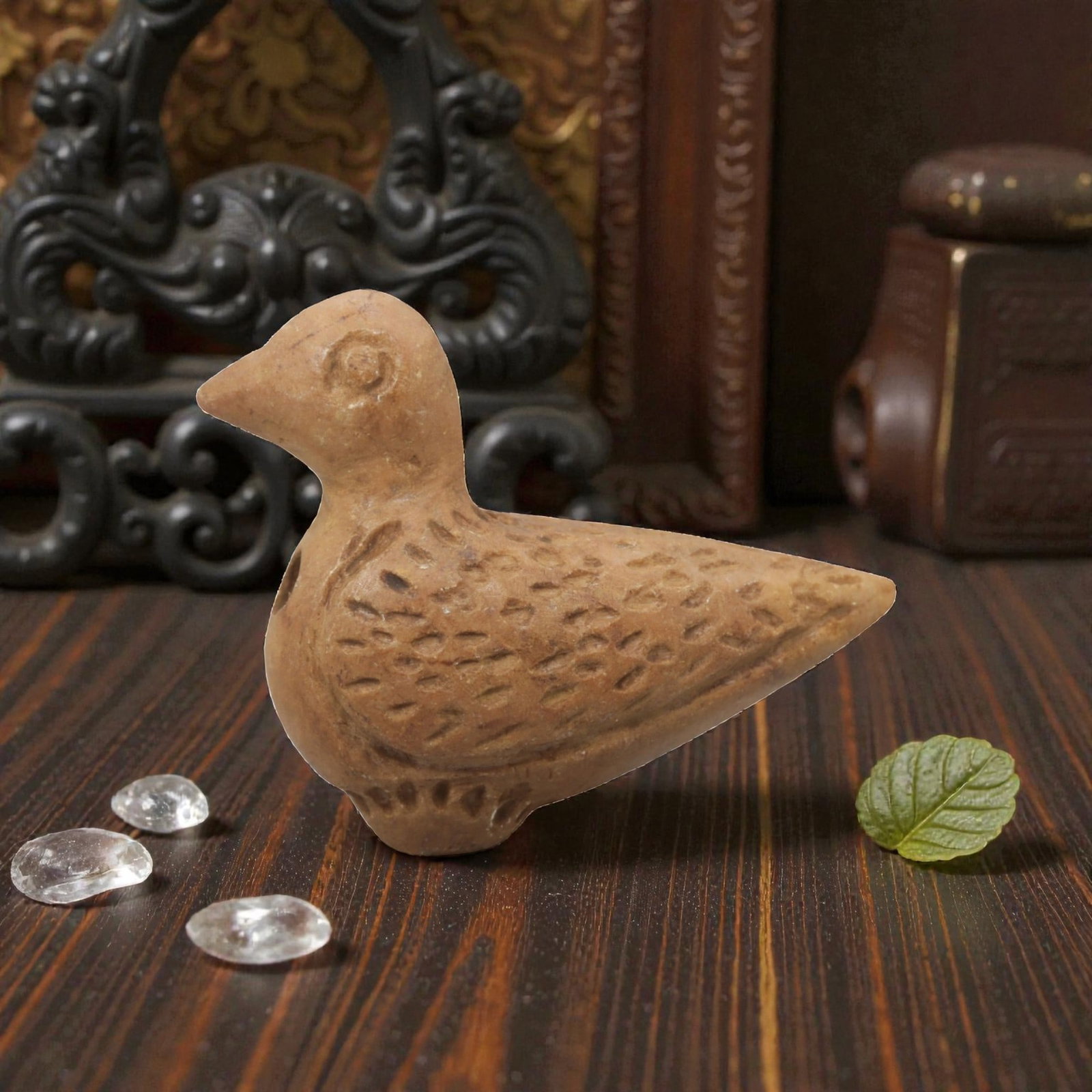 Ancient Steatite Bird Amulet - Near Eastern Carved Figurine, 69ZQ: Carved from steatite, this ancient Near Eastern bird amulet features a compact, stylized avian form with detailed facial features and a textured body surface. The carving exhibits primitive yet expres