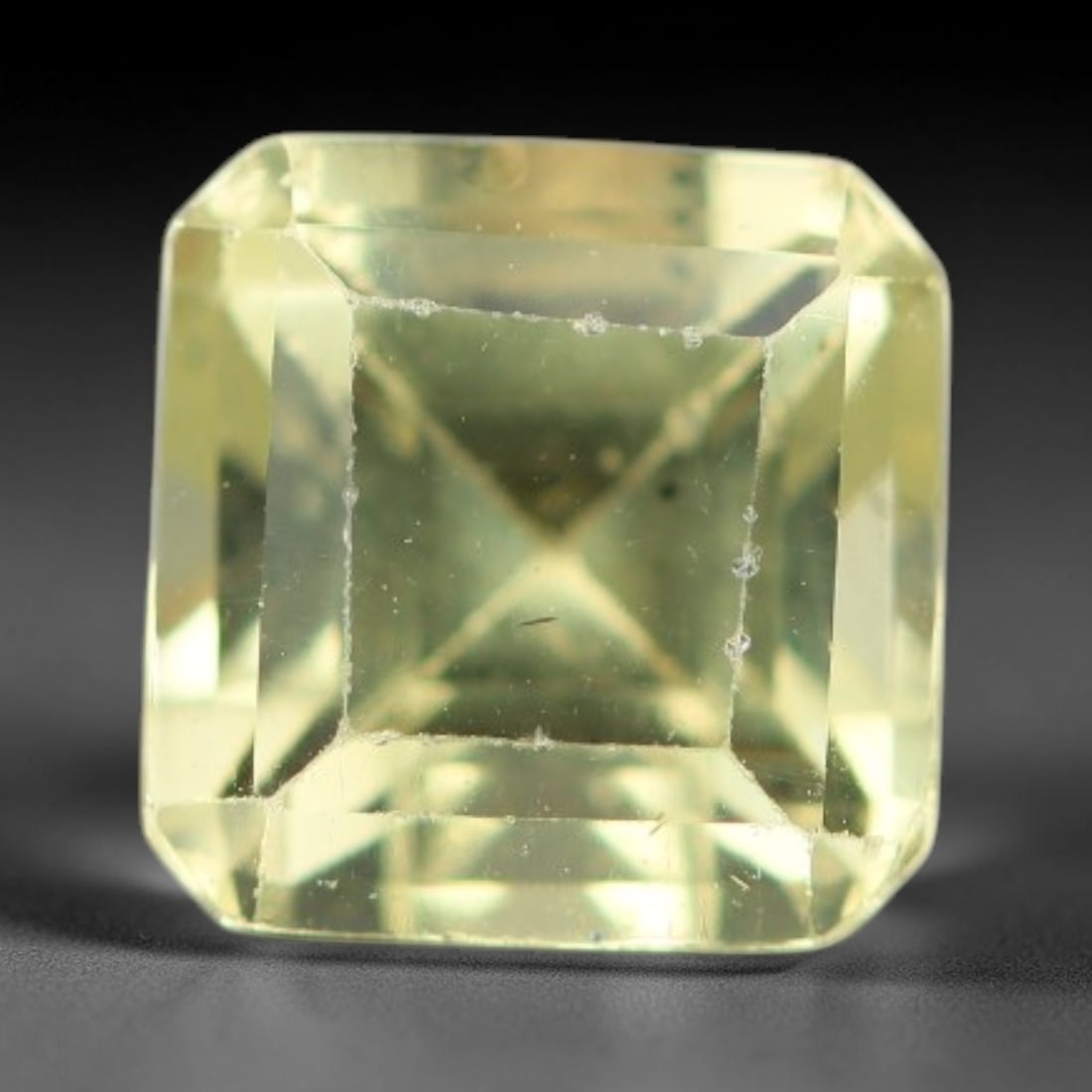 1.50 Carats Natural Pale Yellow Apatite Faceted Loose Gemstone, 45XY: This apatite specimen is sourced from natural geological deposits and shaped with professional faceting and high-gloss polishing work across the outer facet surfaces. Minute internal mineral inclusion