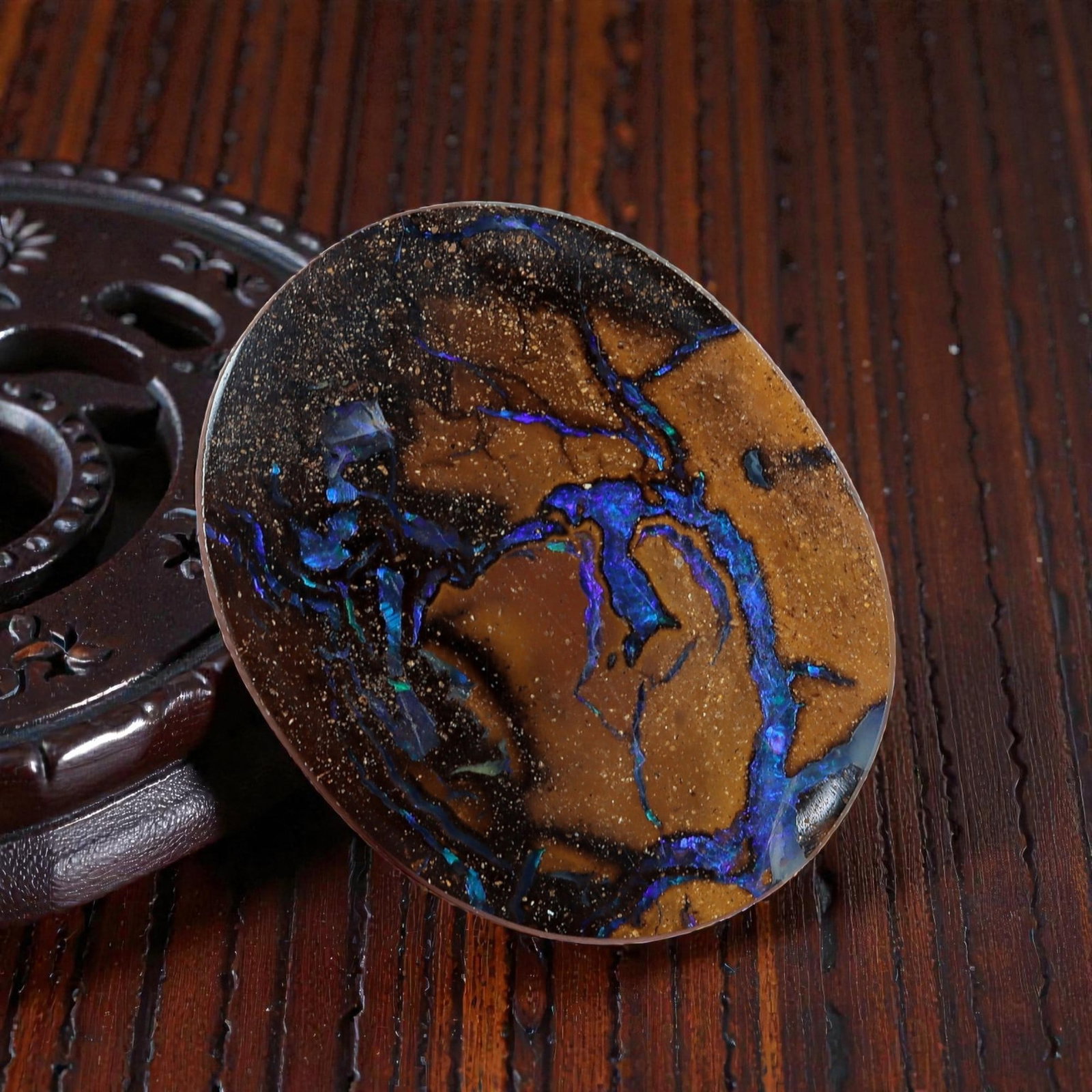 3.63 Carats Koroit Boulder Opal Cabochon - Natural Australian Stones 11.3x9.2mm, 10XM: This exceptional 3.63-carat Koroit boulder opal cabochon is a natural work of art, featuring vivid veins of electric blue and iridescent play-of-color that snake through a warm, earthy ironstone matri