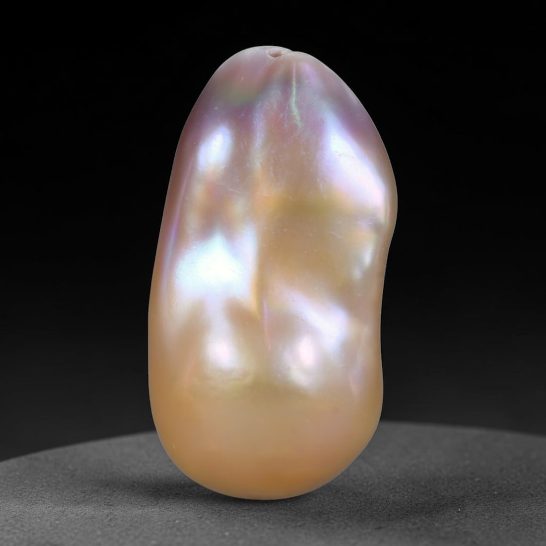 Natural Freshwater Keshi Pearl Baroque Loose Pearl, 99WE: This natural freshwater keshi pearl presents an organic irregular baroque silhouette with rich shifting iridescent nacre displaying soft champagne, peach and lavender overtones across its surface. Sub