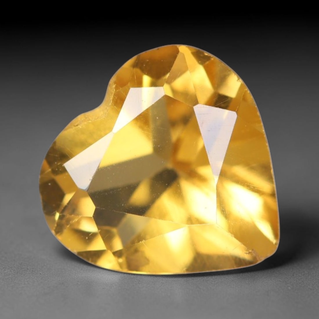 1.77 Carats Natural Golden Yellow Citrine Heart Faceted Loose Gemstone, 90XX: This citrine is harvested from natural quartz deposits and finished with precise faceting and reflective high gloss polishing using professional lapidary workmanship. Minor faint internal crystalline 