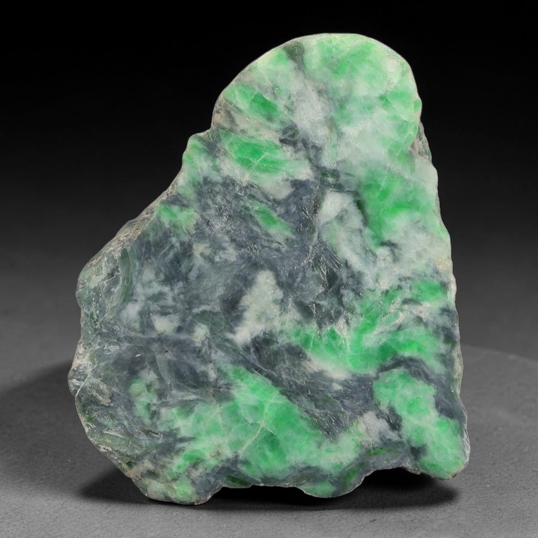 230ct Natural Type A Burmese Jadeite Jade Sliced Rough, 83YN: This specimen is a sliced rough block of natural Type A Burmese jadeite jade. The interior displays natural colour zoning with visible mineral veining and crystalline patterns typical of unprocessed j