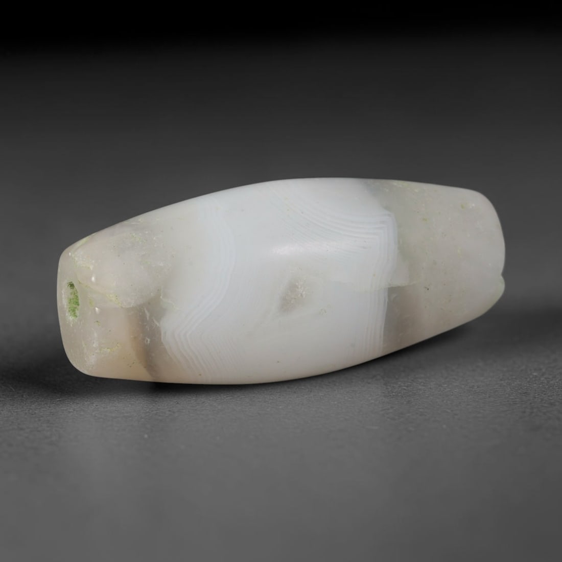 Ancient Gujarat Cambay Post-Harappan Bead Culture Banded Agate Bicone Bead (300 BCE-1000 CE), 2XV: This antique banded agate bicone bead originates from Gujarat Cambay Post-Harappan Bead Culture, a long-standing Western Indian beadmaking hub that supplied uniform polished agate trade beads to Silk 