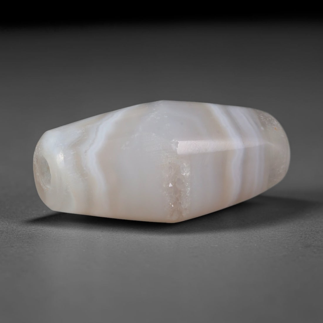 Ancient Coptic Christian Egyptian Culture Banded Agate Bicone Bead (300-1000 CE), 54XD: This antique faceted bicone banded agate bead originates from Coptic Christian Egyptian Culture, a medieval Northeast African civilization that produced agate devotional and burial beads for early Chr