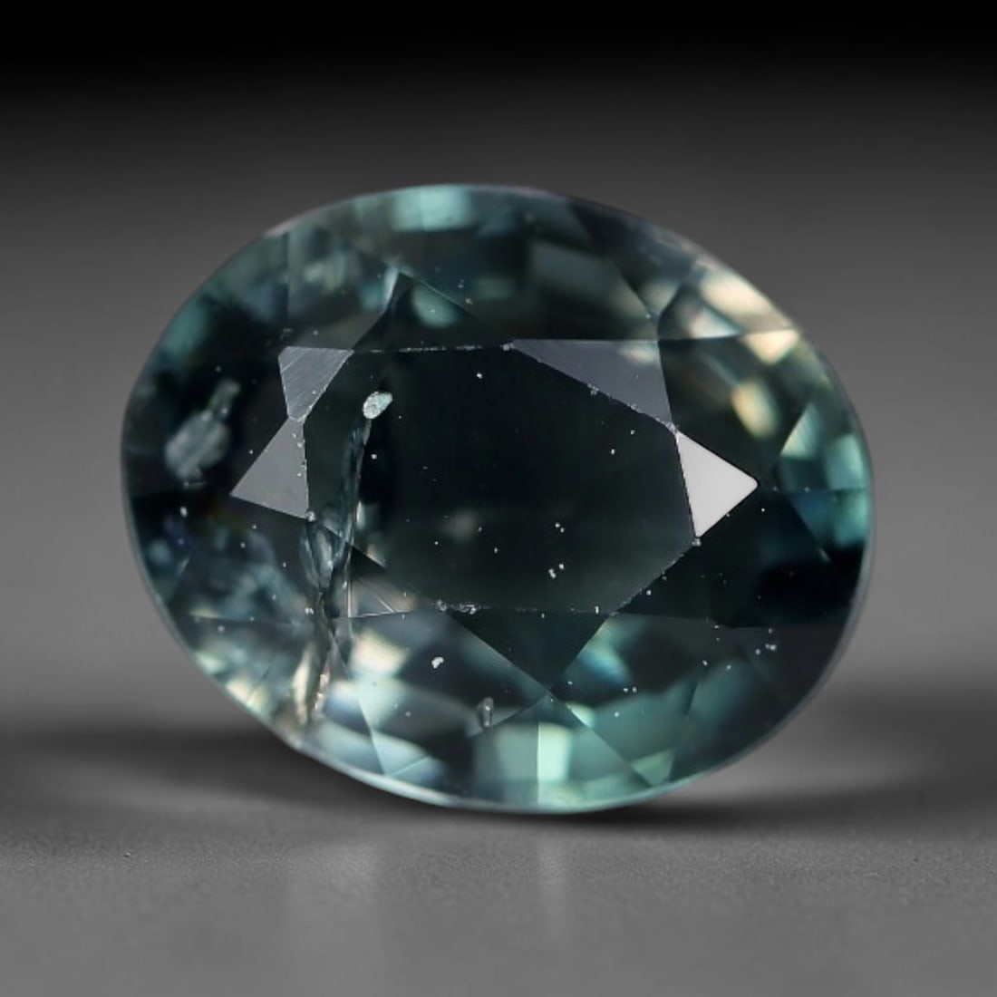 1.24 Carats Natural Deep Teal Blue-Green Oval Faceted Tourmaline Loose Gemstone, 94YG: Natural saturated deep teal blue-green tourmaline precision oval faceted loose gemstone, mixed brilliant facets deliver rich, moody light refraction, showcasing a cool dark seafoam teal tone across th