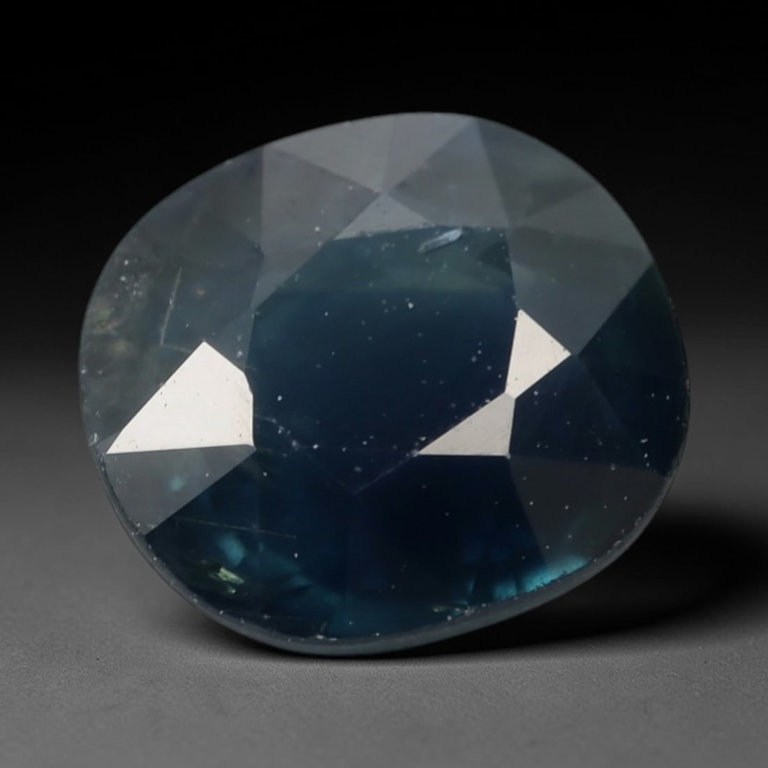 2.23ct Natural Madagascar Teal Blue Sapphire Cushion Loose Faceted Gemstone, LZ294: This natural cushion faceted sapphire sourced from Madagascar weighs 2.23 carats with precise dimensions of 7.8x7.1x4.3mm. It features a unique muted teal navy blue hue, with soft greyish translucent 