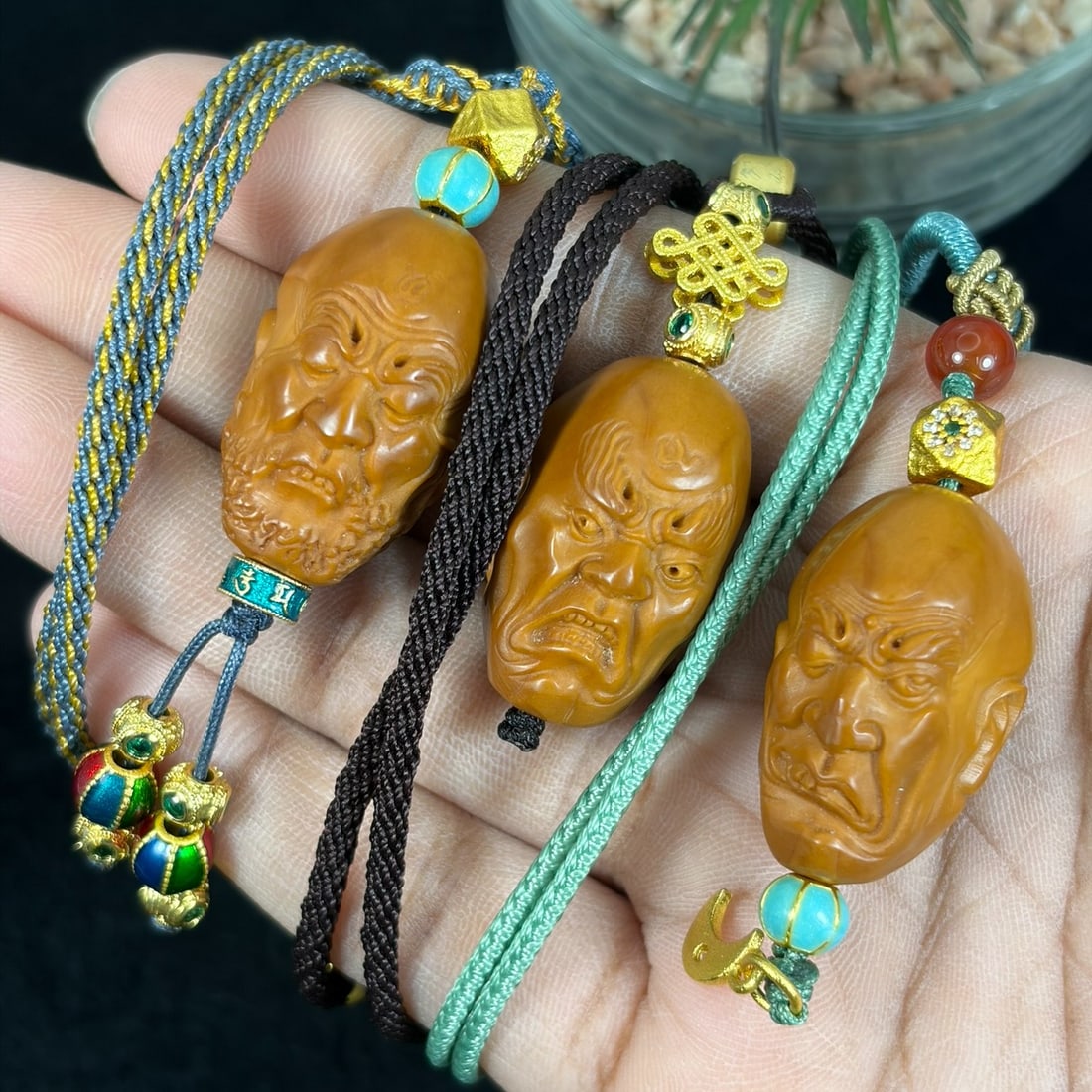 Lot of 3 Hand Carved Olive Nut Arhat Head Pendant Rope Necklaces, 22YJ: This three-piece set features hand-carved olive nut pendants sculpted into detailed arhat head busts with expressive facial textures and fine surface carving, each strung on braided decorative cord ac