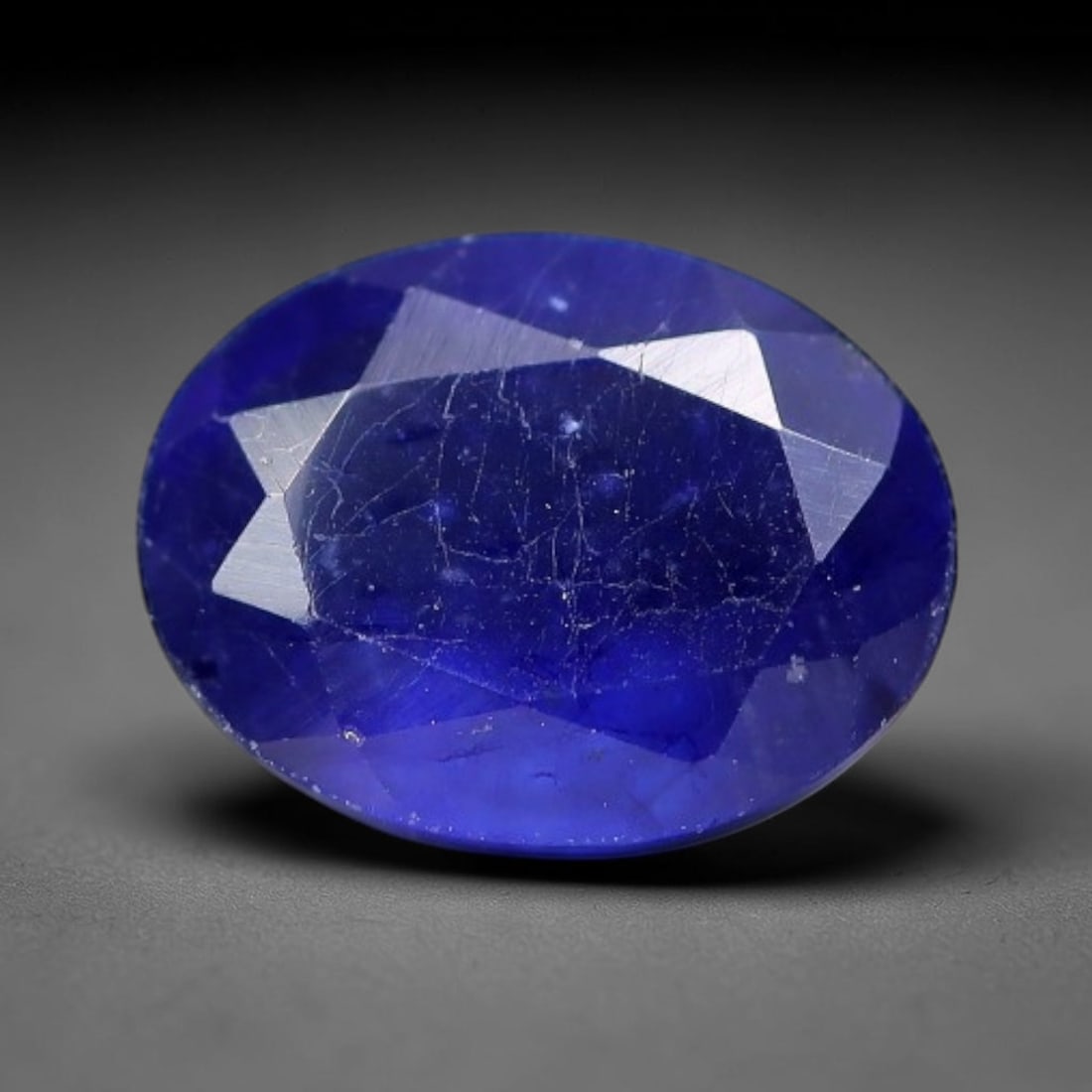1.97 Carats Royal Blue Sapphire Oval Faceted Loose Gemstone, 13WJ: This classic oval faceted sapphire displays rich saturated royal blue color glowing through crisp polished multi-facet cuts, featuring natural fine internal fissures and tiny scattered mineral micro s