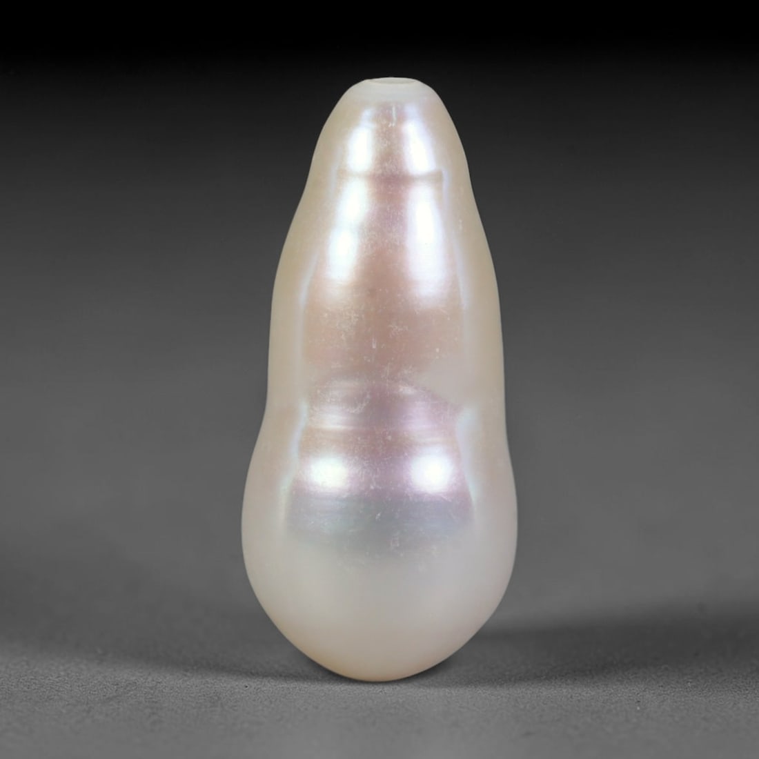 Natural Freshwater Baroque Pearl - Lavender Teardrop Organic Form, 64WE: This natural freshwater baroque pearl features a smooth tapered organic silhouette layered with luminous iridescent nacre, showcasing soft ivory base tones blended with delicate lavender shifting over