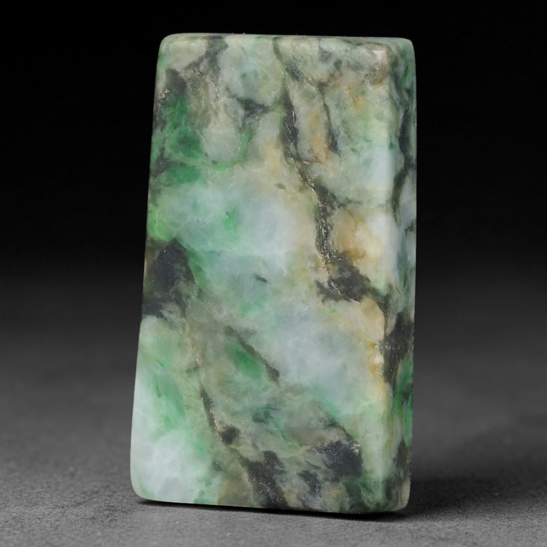 145ct Natural Type A Burmese Jadeite Jade Sliced Rough, 20YK: This specimen is a sliced rough block of natural Type A Burmese jadeite jade. The interior displays natural colour zoning with visible mineral veining and crystalline patterns typical of unprocessed j