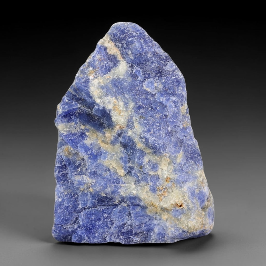 143.34 Carats Natural Royal Blue Sodalite Rough Stone, 85YR: This genuine natural sodalite rough exhibits soft blended royal blue mineral coloration mixed with pale crystalline matrix formed through natural igneous geological formation. Fine light mineral speck