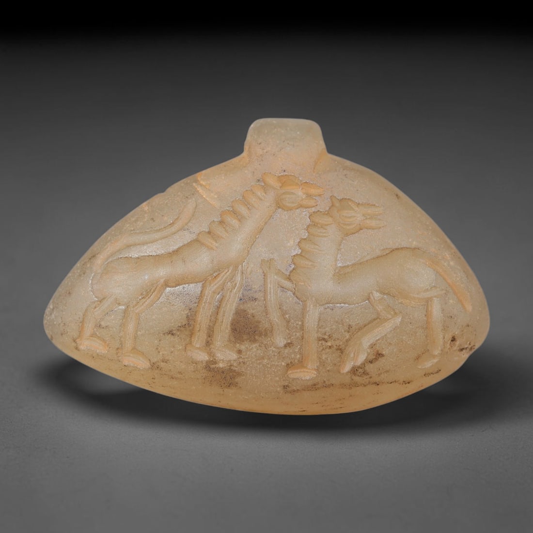 Ancient Sasanian Hand Engraved Chalcedony Plaque Amulet, 40WT: Mid-sized antique wearable sacred tablet expertly carved from natural translucent chalcedony mineral, originating from ancient Sasanian Persian cultural and devotional craft traditions. Chalcedony was