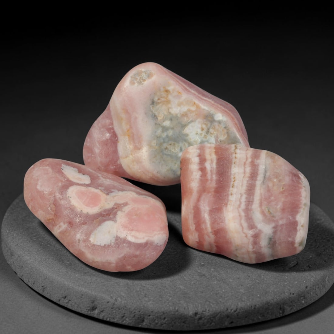 65ct 3pcs Natural Argentine Rhodochrosite Banded Tumbled Rough Set, 10YR: This listing features three individual tumbled rhodochrosite rough pieces sourced from Argentina Capillitas deposits, each showcasing distinct layered banding of soft rose pink, cream white and pale t